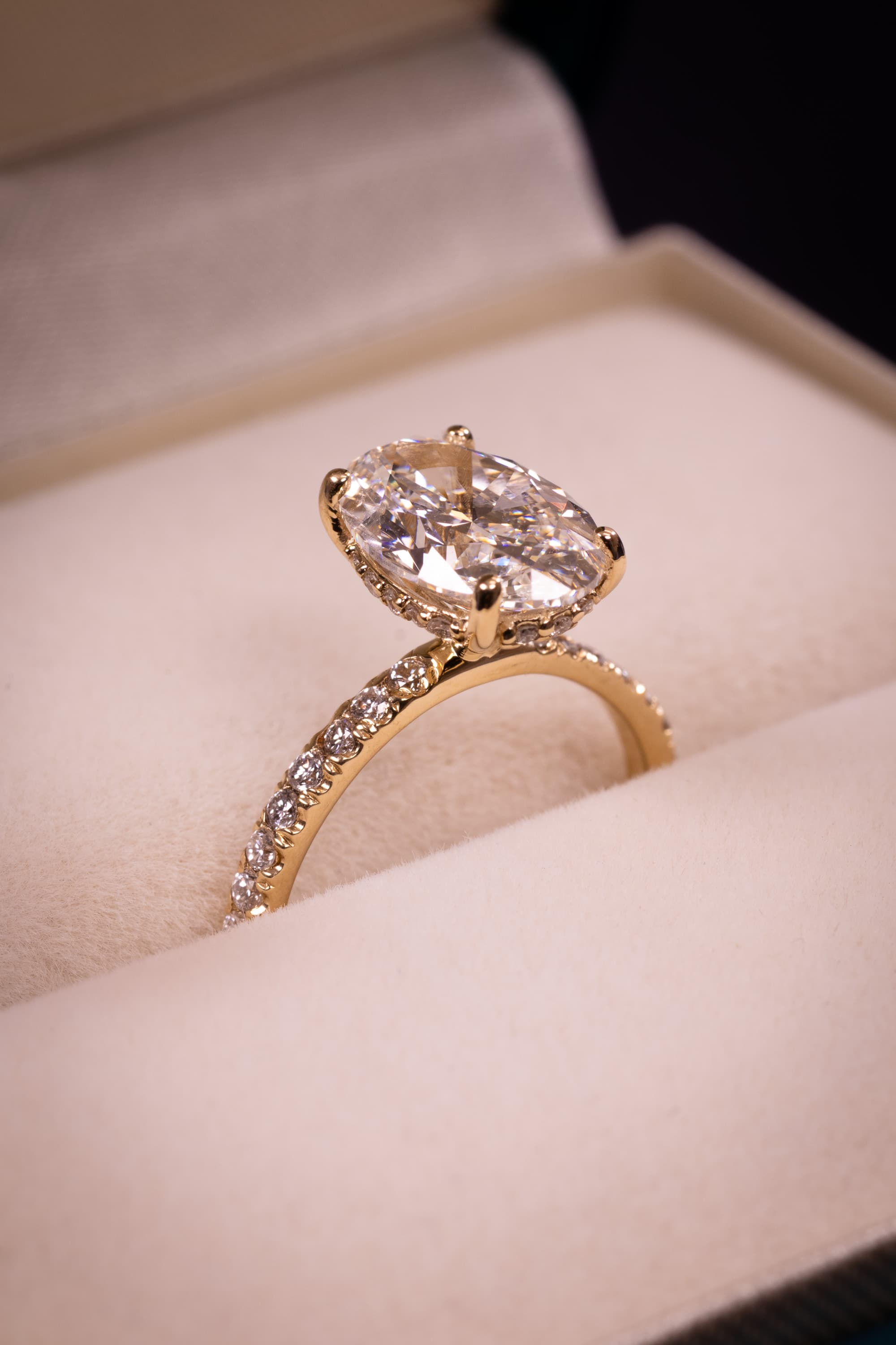 A chunky vintage-inspired yellow gold band with an elongated oval centre stone