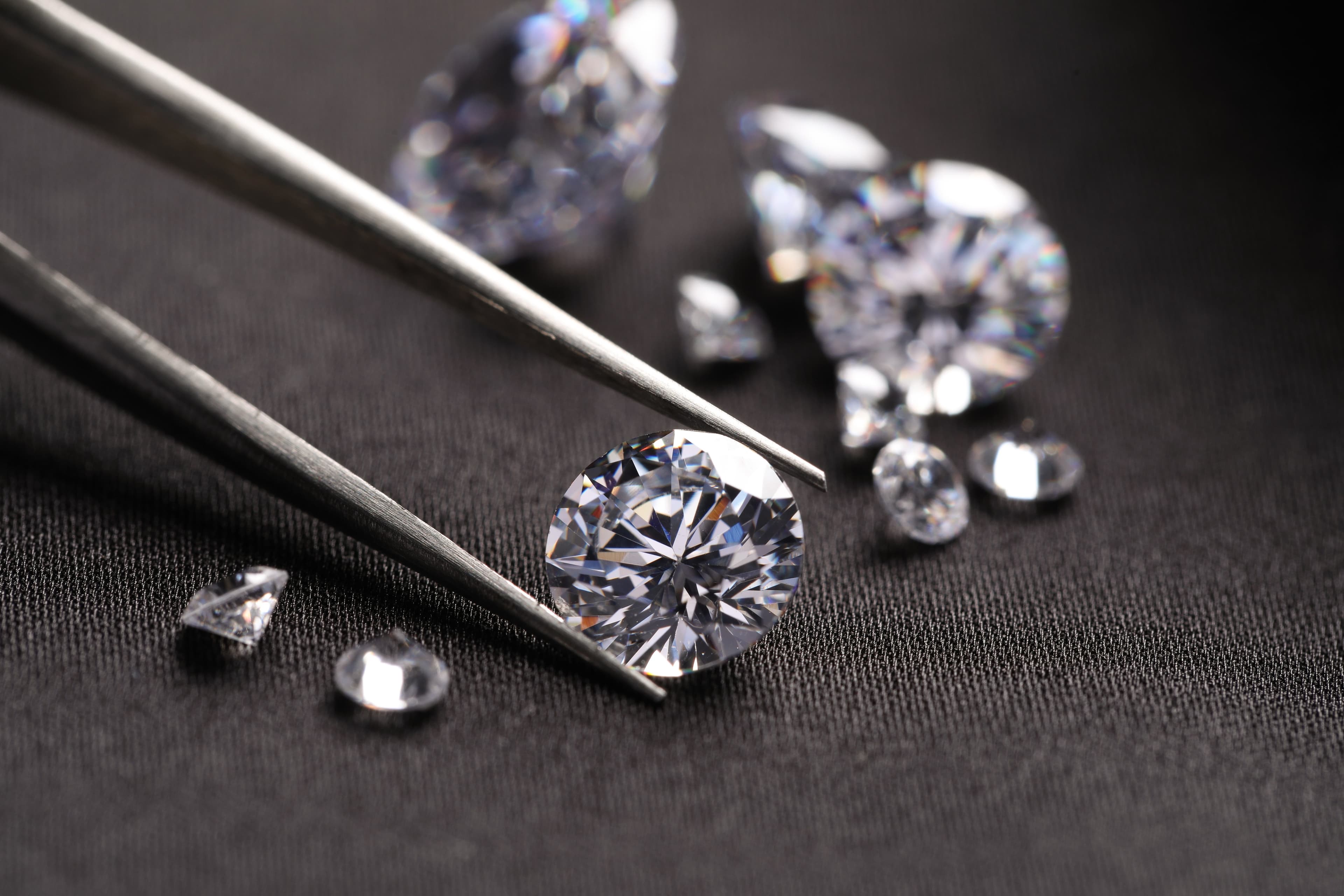 A loose oval lab-grown diamond showing its brilliant facet pattern
