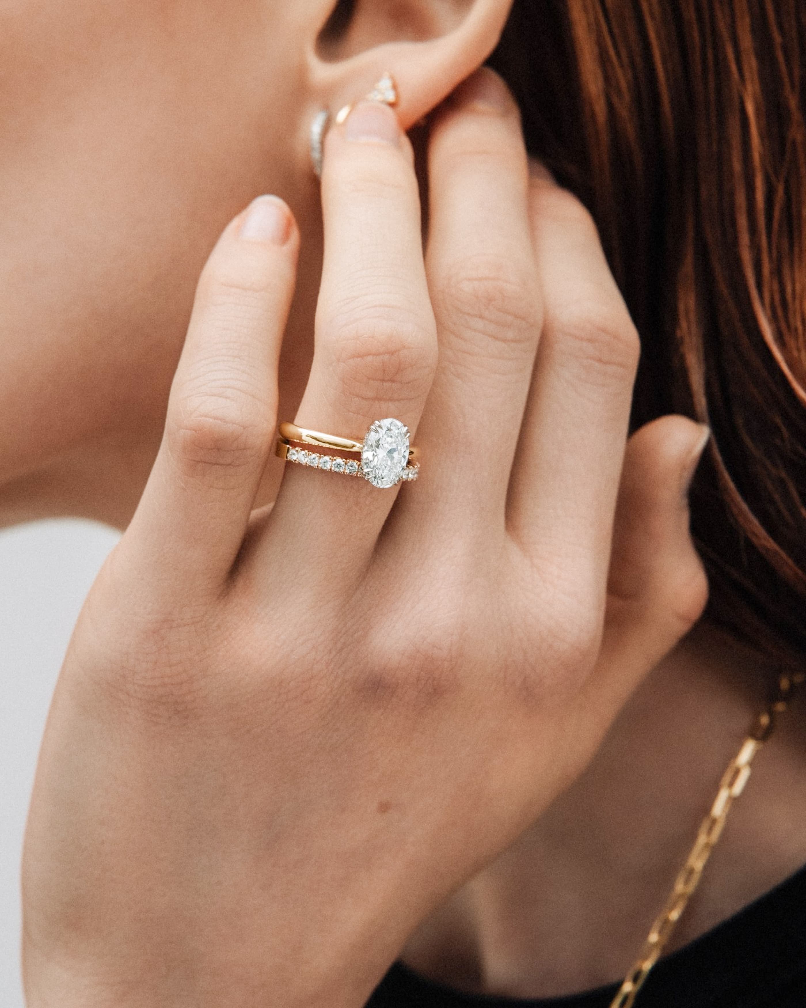 A large oval lab-grown diamond in a slim bezel setting
