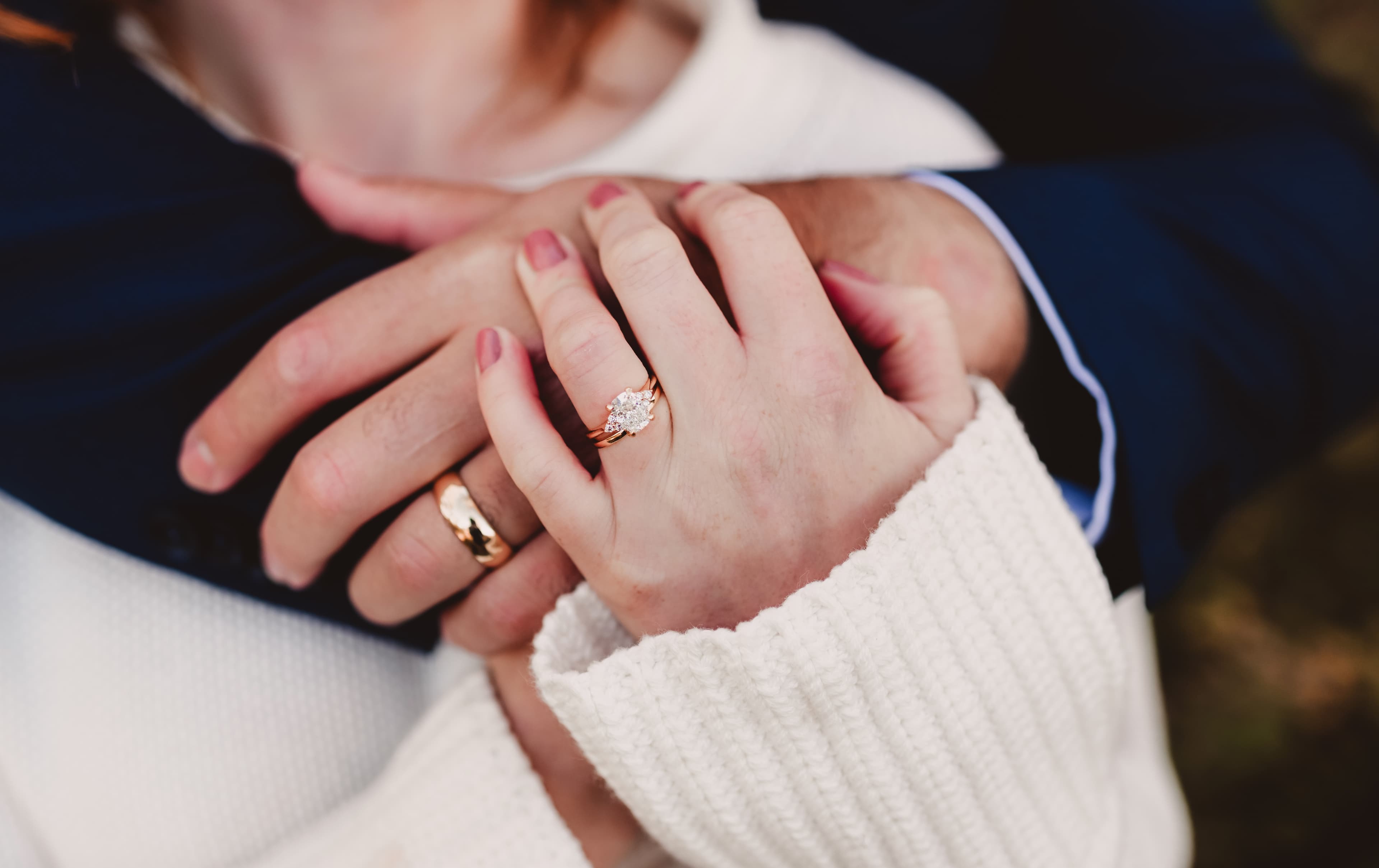 A yellow gold engagement ring nested together with a matching yellow gold wedding band as a bridal pair